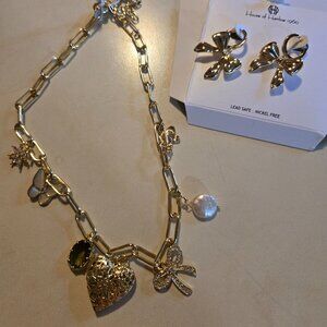 Gold paperclip chain with 7 charm necklace and bow coordinating earrings. NWT